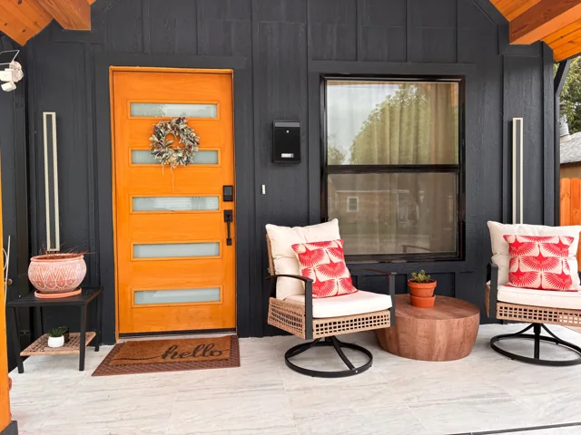 The gold door and welcoming front porch