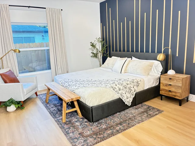 Room 3 with its navy and gold accent wall